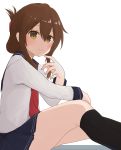  1girl bangs black_legwear blue_skirt blush brown_eyes brown_hair closed_mouth feet_out_of_frame folded_ponytail from_side hair_ornament hand_up highres inazuma_(kantai_collection) kantai_collection kneehighs long_hair long_sleeves looking_at_viewer neckerchief necktie pleated_skirt red_neckwear sailor_collar school_uniform serafuku shirt sidelocks simple_background sitting skirt smile solo spica1476 white_background white_shirt 