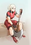  1girl axe bike_shorts blonde_hair edelgard_von_hresvelg fire_emblem fire_emblem:_three_houses gym_shirt gym_shorts highres long_hair papers_ev scar shirt shoes shorts sitting sneakers solo tied_hair 