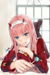  1girl artist_name asurada_yui bangs black_legwear commentary_request darling_in_the_franxx eyebrows_visible_through_hair green_eyes hairband holding_lollipop horns indoors long_hair long_sleeves looking_at_viewer lying on_stomach pantyhose pink_hair red_horns solo tongue tongue_out zero_two_(darling_in_the_franxx) 