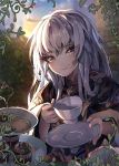 1girl absurdres ahoge blurry blurry_background cappukappa closed_mouth cookie cup fire_emblem fire_emblem:_three_houses food highres holding holding_cup holding_plate long_hair long_sleeves looking_at_viewer lysithea_von_ordelia muffin outdoors pink_eyes plate smile solo teacup tiered_tray twilight white_hair wide_sleeves 