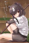  1girl animal_ears arm_rest bangs bear_ears bear_girl bear_paw_hammer bear_tail bike_shorts black_hair black_skirt brown_bear_(kemono_friends) brown_eyes crossed_arms elbow_gloves extra_ears eyebrows_visible_through_hair fingerless_gloves from_side gloves hair_between_eyes highres kemono_friends knee_up looking_at_viewer microskirt multicolored_hair open_mouth outstretched_leg over_shoulder shirt shoes short_hair short_sleeves shorts shorts_under_skirt sidelocks sitting skirt smile solo tadano_magu tail translated two-tone_hair weapon weapon_over_shoulder white_hair 