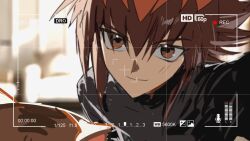  1boy adjusting_camera black_shirt brown_eyes brown_hair cat cocaduel highres pharaoh_(cat) recording shirt sidelocks smile viewfinder yu-gi-oh! yu-gi-oh!_gx yuki_judai 