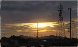  blurry border clouds commentary dark depth_of_field ground_vehicle hill motor_vehicle no_humans original power_lines rural scenery signature sky sunlight sunset telephone_pole town twilight van yk_funa 