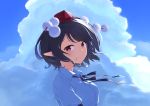  1girl bangs black_hair black_ribbon blue_sky clouds commentary day from_side hair_blowing hat highres kanpa_(campagne_9) light_smile looking_at_viewer neck_ribbon outdoors pointy_ears pom_pom_(clothes) puffy_short_sleeves puffy_sleeves red_eyes red_headwear ribbon shameimaru_aya shirt short_hair short_sleeves sky solo standing swept_bangs tokin_hat touhou upper_body white_shirt wind 