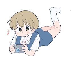  1girl aged_down ayumu_niikura blonde_hair blue_shorts blue_vest camera city_(arawi_keiichi) closed_mouth collared_shirt digital_camera dot_nose highres holding holding_camera leg_up looking_at_viewer musical_note red_ribbon ribbon shirt short_hair shorts simple_background smile socks solo vest white_background white_shirt white_socks wichimi yellow_eyes 