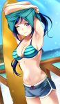  1girl beach bikini blue_hair blue_shorts blue_sky cowboy_shot day dutch_angle highres horizon light_rays long_hair looking_at_viewer love_live! love_live!_sunshine!! matsuura_kanan mountain ocean outdoors ponytail short_shorts shorts sky smile solo solo07450075 standing striped striped_bikini striped_bikini_top sunbeam sunlight surfboard swimsuit undressing violet_eyes 