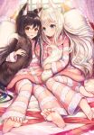  2girls animal_ear_fluff animal_ears barefoot bed black_hair blue_eyes blush brown_eyes canopy_bed commentary_request curtains day feet fox_ears fox_girl fox_tail highres holding_tail indoors long_hair long_sleeves looking_at_another looking_at_viewer multiple_girls nose_blush on_bed open_mouth original pajamas pillow sakura_ani silver_hair sitting striped striped_sweater sweater tail window 