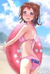  1girl ass bang_dream! beach bikini blue_sky blush breasts brown_hair clothes_writing clouds commentary_request cowboy_shot embarrassed highres innertube looking_at_viewer medium_breasts open_mouth outdoors pink_bikini short_hair sky solo standing swimsuit toyama_kasumi violet_eyes yamamoto_chavez 