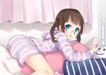  1girl :o bangs blue_eyes bon_(bonbon315) book braid brown_hair commentary_request curtains glasses holding holding_book indoors lying on_pillow on_stomach open_mouth original pillow short_hair solo striped_hoodie twin_braids 