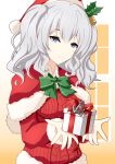  1girl alternate_costume anchor blue_eyes box capelet commentary_request fur-trimmed_capelet fur_trim gift gift_box gradient gradient_background gudon_(iukhzl) hat kantai_collection kashima_(kantai_collection) long_hair looking_at_viewer red_capelet red_headwear red_sweater santa_hat sidelocks silver_hair solo sweater twintails upper_body wavy_hair 