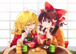  2girls bangs blonde_hair blush bow bowl braid brown_hair chopsticks cup eating eyebrows_visible_through_hair food frilled_bow frills fruit green_neckwear hair_between_eyes hair_bow hair_tubes hakurei_reimu highres holding holding_bowl holding_chopsticks indoors japanese_clothes kirisame_marisa kotatsu long_hair long_sleeves multiple_girls no_hat no_headwear open_mouth orange poprication red_bow red_eyes ribbon single_braid sitting steam table teacup touhou yellow_eyes yellow_neckwear 