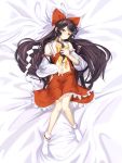  1girl absurdres bangs bare_shoulders bed_sheet bow bowtie braid brown_hair closed_mouth collared_shirt dakimakura detached_sleeves eyelashes frilled_bow frilled_shirt_collar frilled_skirt frilled_sleeves frills full_body gohei hair_bow hair_tubes hakurei_reimu highres holding_orb long_hair looking_at_viewer midriff navel no_shoes red_bow red_nails red_shirt red_skirt ribbon-trimmed_sleeves ribbon_trim sarashi shirt shirt_lift sidelocks skirt sleeveless sleeveless_shirt sleeves_past_wrists smile solo swept_bangs tabi touhou white_legwear yal_(lily910218) yellow_bow yin_yang_orb 