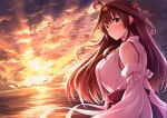  1girl ahoge blush breasts brown_hair closed_mouth clouds detached_sleeves double_bun eyebrows_visible_through_hair grey_eyes hair_between_eyes hair_ornament hairband japanese_clothes kantai_collection kongou_(kantai_collection) large_breasts long_hair looking_at_viewer nicoby nontraditional_miko ocean solo sunlight sunset 