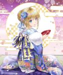  1girl ahoge akatsuki_hijiri artoria_pendragon_(all) bangs blue_flower blue_kimono blue_ribbon braid commentary_request eyebrows_visible_through_hair fate/grand_order fate_(series) floral_print flower from_behind highres holding japanese_clothes kimono kneeling looking_at_viewer purple_flower ribbon saber smile translation_request 