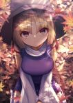  1girl bangs blonde_hair blurry blurry_background blurry_foreground breasts brown_headwear closed_mouth darumoon eyebrows_visible_through_hair from_above hands_together highres large_breasts leaf long_sleeves looking_at_viewer maple_leaf medium_hair moriya_suwako outdoors parted_bangs purple_vest seiza shirt sidelocks sitting smile solo thigh-highs touhou v_arms vest white_legwear white_shirt wide_sleeves yellow_eyes 