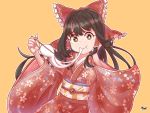  1girl :t alternate_costume arms_up artist_name black_hair bow bright_pupils brown_eyes cherry_blossom_print chopsticks commentary_request cowboy_shot eating floral_print food_in_mouth furisode hair_bow hair_tubes hakurei_reimu hand_on_own_face highres holding holding_chopsticks japanese_clothes kimono leaning_to_the_side long_hair looking_at_viewer mochi obi orange_background outline partial_commentary print_kimono sash sidelocks simple_background solo standing touhou very_long_hair white_pupils zanasta0810 