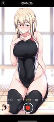  1girl black_legwear black_swimsuit blonde_hair breasts competition_swimsuit covered_navel embarrassed full_body graf_zeppelin_(kantai_collection) grey_eyes hair_between_eyes hand_on_own_chest highleg highleg_swimsuit highres kantai_collection kneeling large_breasts long_hair looking_at_viewer one-piece_swimsuit osterei phone_screen sidelocks solo swimsuit thigh-highs tsurime twintails viewfinder 