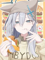  >_< 1girl :d blue_archive blue_eyes border cardigan clothes_writing commentary cross_hat_ornament earrings eating food food_on_face grey_hair grey_shirt hair_between_eyes halo hat hat_with_ears highres holding holding_food jewelry k-d licking_lips long_hair long_sleeves looking_at_viewer mismatched_pupils outline shiroko_terror_(blue_archive) shirt smile solo sparkle stud_earrings tongue tongue_out upper_body white_outline wing_collar xd yellow_cardigan 