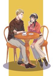  1boy 1girl black_hair black_shoes blonde_hair blush border bow bowtie breasts brown_shoes brown_sweater chain closed_eyes collared_shirt couple crossed_arms cup full_body grey_pants grey_shirt hetero highres holding holding_cup leaning_to_the_side light_smile long_hair looking_at_another medium_breasts open_mouth pants pillarboxed pink_bow pink_bowtie red_shirt saucer shirt shirt_under_sweater shoes short_hair sidelocks sitting sleeves_rolled_up smile spy_x_family sweater table teacup twilight_(spy_x_family) umini_ikukara updo white_border yellow_background yor_briar 