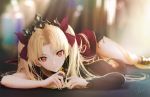  1girl blonde_hair blurry crown depth_of_field ereshkigal_(fate/grand_order) fate/grand_order fate_(series) long_hair looking_at_viewer lying ojay_tkym on_stomach red_eyes red_ribbon ribbon signature single_thighhigh skull_collar solo solo_focus thigh-highs twintails 