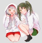  2girls alternate_costume anbutter_siruko bangs black_legwear blush character_name eyebrows_visible_through_hair green_eyes green_hair green_shorts grey_background grin hair_ribbon heart hood hood_down hood_up hooded_jacket hoodie jacket kantai_collection long_hair long_sleeves multiple_girls one_eye_closed open_mouth red_skirt ribbon shorts shoukaku_(kantai_collection) sitting skirt smile socks squatting twintails white_hair white_hoodie zuikaku_(kantai_collection) 