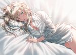  1girl an-94_(girls_frontline) bangs blonde_hair blue_eyes blush breasts girls_frontline hairband long_hair long_sleeves looking_at_viewer lying on_bed on_side open_mouth shirt sidelocks silence_girl sleeves_folded_up thighs white_shirt 