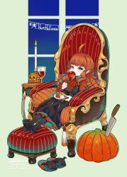  1girl ahoge apple armchair brown_hair cake candle chair dress eating fang food footrest fruit green_eyes halloween highres lolibaba long_hair looking_at_viewer mimit original pumpkin sitting slippers solo towako_(akane_shinsha) 