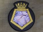  absurdres azur_lane belfast_(azur_lane) highres royal_navy ship&#039;s_badge 