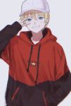  1boy alternate_costume baseball_cap blonde_hair blue_eyes fate/strange_fake fate_(series) flat_eskardos hand_in_pocket hat highres hood hoodie lord_el-melloi_ii_case_files makimura_(miwmiw-cage) male_focus sleeves_past_wrists smile solo v 