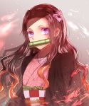  1girl asa_no_ha_(pattern) bamboo bit_gag brown_hair checkered_obi fire gag gradient gradient_background gradient_hair grey_background hair_ribbon haori highres japanese_clothes kamado_nezuko kimetsu_no_yaiba kimono light_particles long_hair looking_at_viewer multicolored_hair obi pink_eyes pink_kimono redhead ribbon sash solo standing unmoving_pattern very_long_hair yuzune_ek 