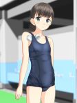  1girl black_hair blue_swimsuit blurry collarbone commentary_request cowboy_shot depth_of_field flat_chest green_eyes highres low_ponytail old_school_swimsuit original ponytail school_swimsuit short_hair solo standing swim_cap_removed swimsuit takafumi 