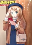 1girl alternate_costume bag blonde_hair blue_dress blue_eyes blue_headwear brown_coat cellphone coat commentary_request cowboy_shot dress jervis_(kantai_collection) kantai_collection long_hair mayura2002 open_mouth phone sign solo standing 