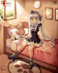  1girl absurdres bangs bed black_ribbon blunt_bangs blush clock commentary_request eyebrows_visible_through_hair facial_mark girls_frontline green_eyes hair_ornament hair_ribbon hat highres hk416_(girls_frontline) huge_filesize indoors long_hair long_sleeves looking_at_viewer on_bed pillow recording ribbon silver_hair sitting socks solo stuffed_animal stuffed_toy teddy_bear very_long_hair wabbajack window 