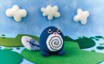  amigurumi_(medium) asako_ito black_eyes blue_sky clouds cloudy_sky commentary creature day english_commentary gen_1_pokemon lily_pad multiple_sources nature outdoors photo pokemon pokemon_(creature) pokemon_trading_card_game poliwag sky standing third-party_source unconventional_media 