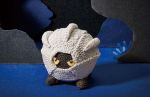  amigurumi_(medium) asako_ito cave commentary creature english_commentary gen_3_pokemon multiple_sources nature no_humans photo pokemon pokemon_(creature) pokemon_trading_card_game shadow shelgon solo standing third-party_source unconventional_media yellow_eyes 