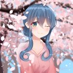  1girl absurdres blue_eyes blue_hair blurry cherry_blossoms collarbone commentary_request depth_of_field gotland_(kantai_collection) hair_bun highres kantai_collection long_hair looking_at_viewer mole mole_under_eye numarinko one_eye_closed petals pink_shirt shirt smile solo upper_body 