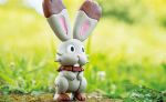  black_eyes bunnelby bunny_focus commentary creature english_commentary full_body gen_6_pokemon grass morii_yuka multiple_sources no_humans official_art photo pokemon pokemon_(creature) pokemon_trading_card_game rabbit solo standing third-party_source 