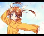  1girl bangs blue_sky blurry closed_mouth clouds cloudy_sky commentary day eyebrows_visible_through_hair hair_ribbon hand_on_own_head highres kuroi_mimei letterboxed light_blush light_particles long_sleeves looking_at_viewer lyrical_nanoha orange_shirt outdoors petals ribbon shirt short_hair sky sleeves_past_wrists smile solo takamachi_nanoha twintails upper_body white_ribbon wind 