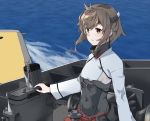  1girl anchor bangs brown_eyes brown_hair covered_navel eyebrows_visible_through_hair flat_chest headband headgear highres kantai_collection long_sleeves ocean outdoors parted_lips red_skirt rigging short_hair skirt solo sui_(sui27shika) taihou_(kantai_collection) water 