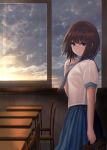  1girl blue_eyes blue_neckwear blue_skirt bob_cut brown_hair chair classroom clouds desk expressionless from_side hand_on_own_chest highres looking_at_viewer looking_to_the_side neckerchief original pleated_skirt school_uniform serafuku shirt short_hair skirt sky solo sorami_sachi sunset white_shirt window 
