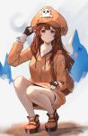  1girl absurdres brown_eyes brown_hair guilty_gear guilty_gear_strive highres hood hoodie legs may may_(guilty_gear) ni_dgs orange_headwear orange_hoodie skull_and_crossbones squatting 