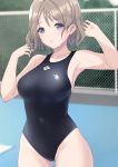  1girl absurdres arhah black_swimsuit blue_eyes breasts chain-link_fence commentary_request competition_swimsuit cowboy_shot day fence grey_hair highres large_breasts logo looking_at_viewer love_live! love_live!_sunshine!! one-piece_swimsuit outdoors pool short_hair solo standing swimsuit watanabe_you wet 