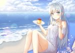  1girl bangs bare_shoulders beach blue_eyes blush breasts clouds collarbone commentary_request dress eyebrows_visible_through_hair food grey_hair hair_between_eyes highres holding holding_spoon kokose long_hair looking_at_viewer medium_breasts ocean original silver_hair sitting smile solo spoon 