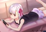  1girl bangs bare_arms black_shirt blush_stickers couch fate/grand_order fate_(series) hair_ornament hair_ribbon jitome kama_(fate/grand_order) leg_up lying nintendo_switch on_couch on_stomach pink_eyes playing_games purple_shorts ribbon shirt short_hair shorts simple_background white_hair zenshin 