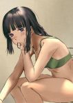  1girl bangs black_hair blunt_bangs blush bottomless bra breasts chin_rest eyebrows_visible_through_hair green_bra grey_background hair_tie hair_tie_in_mouth highres kantai_collection kitakami_(kantai_collection) long_hair mouth_hold sakieko sidelocks simple_background sitting small_breasts solo underwear violet_eyes 