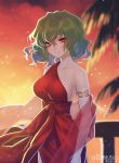  1girl alternate_costume armlet bangs bare_arms bare_shoulders breasts closed_mouth collarbone commission commissioner_upload cowboy_shot dress green_hair hair_between_eyes hand_on_railing highres kazami_yuuka large_breasts light_particles looking_at_viewer matsuda_toki medium_hair outdoors palm_tree railing red_dress red_eyes sash shawl single_strap smile solo standing strapless sunset touhou tree upper_body wavy_hair 