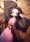  1girl absurdres arms_up bamboo bit_gag black_hair black_haori blush checkered_obi commentary_request female gag hair_ribbon haori highres japanese_clothes kamado_nezuko kimetsu_no_yaiba kimono long_sleeves lying mouth_hold multicolored_hair on_back orange_hair pink_eyes pink_kimono pink_ribbon ribbon ryon_y0421 slit_pupils solo two-tone_hair wide_sleeves 