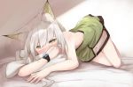  1girl animal_ear_fluff animal_ears arknights bangs bare_arms bare_shoulders bed_sheet blush dress green_dress green_eyes highres kal&#039;tsit_(arknights) kashiyarrm looking_at_viewer short_dress silver_hair solo strapless strapless_dress thighs top-down_bottom-up watch watch white_background 
