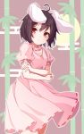  1girl ahoge animal_ears bamboo black_hair carrot_necklace cowboy_shot dress expressionless full_moon highres inaba_tewi looking_at_viewer moon nankotsu pink_dress puffy_short_sleeves puffy_sleeves rabbit_ears red_eyes ribbon-trimmed_dress ribbon-trimmed_sleeves ribbon_trim short_hair short_sleeves solo standing touhou 