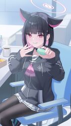  1girl absurdres animal_ears black_choker black_hair black_hoodie black_pantyhose blue_archive blush cat_choker cat_ears cat_girl choker colored_inner_animal_ears colored_inner_hair extra_ears food fukujin green_sailor_collar grin halo hands_up highres holding holding_food holding_macaron hood hood_down hoodie incoming_food indoors jacket kazusa_(blue_archive) looking_at_viewer macaron multicolored_hair neckerchief pantyhose pink_hair pink_halo pink_neckerchief pleated_skirt red_eyes sailor_collar short_hair sitting skirt smile solo two-tone_hair white_skirt 